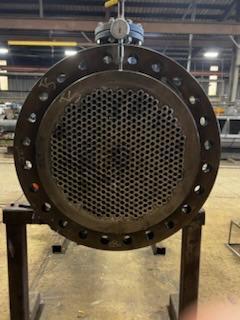 Close-up of tube sheet face on heat exchanger component prepared for inspection and documentation.